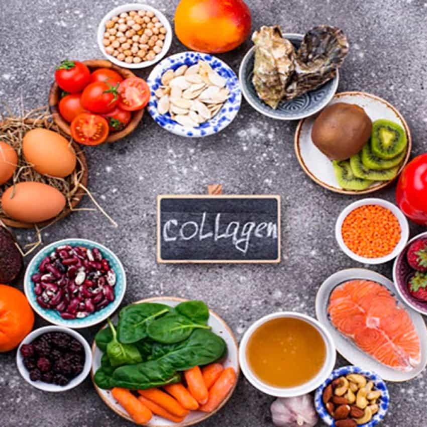 Assorted collagen-rich foods including eggs, fish, spinach, nuts, fruits, and vegetables