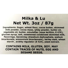 Milka & Lu 87g ingredient and allergen label showing milk, gluten, soy, and nut warnings.