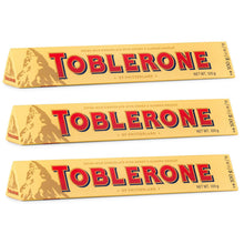 Three Toblerone Swiss milk chocolate bars with honey & almond nougat, 100g each, imported snack