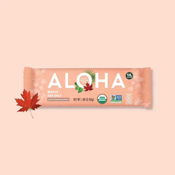 ALOHA Maple Sea Salt plant-based protein bar with a red maple leaf on a light pink background.