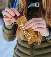 ALOHA Chocolate Espresso Protein Bar unwrapped showing texture