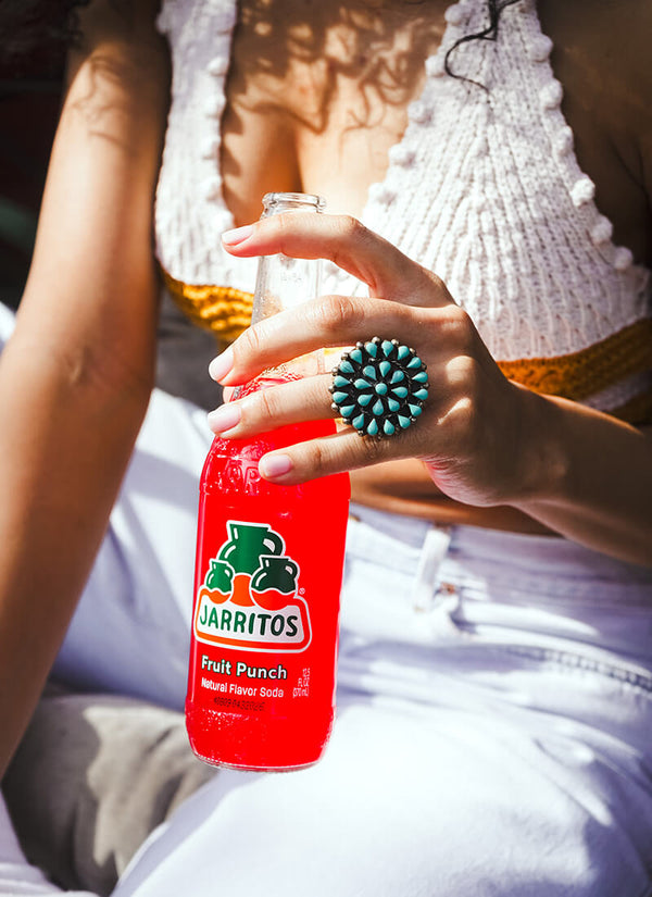 Jarritos Fruit Punch soda bottle on ice