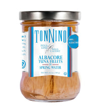 Jar of Tonino tuna fillets with a white label on a white background
