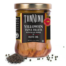 Jar of Tonnino yellowfin tuna fillets with black pepper in olive oil on a white background