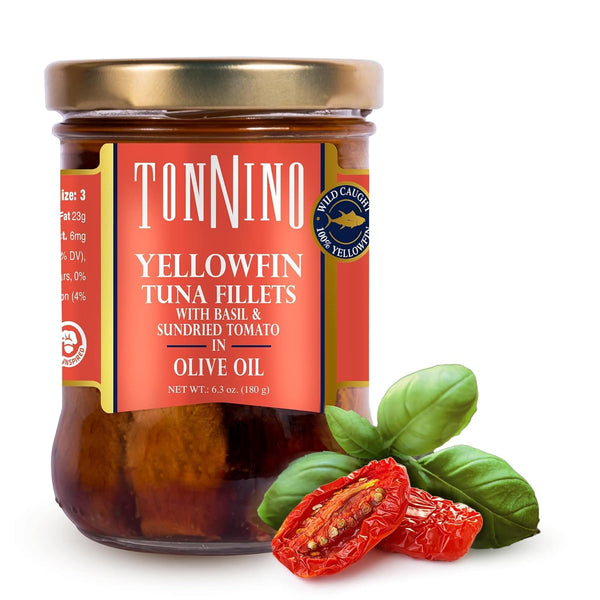 Jar of Tonnino yellowfin tuna fillets with basil and sundried tomato in olive oil on a white background