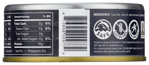 Close-up of a canned tuna product label showing nutrition facts, ingredients, and certification logos on a dark background.