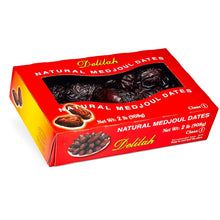 A red and yellow box of Delilah Natural Medjoul Dates, showing a clear window with dark brown dates inside, on a white background.