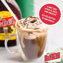 Fox's U-Bet chocolate syrup drizzled over iced coffee in glass mug, thick & smooth, 22 oz bottle