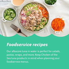 Healthy tuna rice bowl with avocado, carrots, cucumber, and sauce, ideal for meal prep.