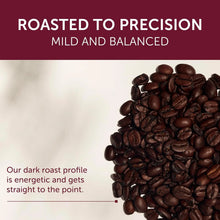 Dark roasted coffee beans on white background with roasted to precision text, premium coffee product.