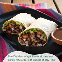 Black bean burrito with lettuce, tomato, onion, and sauce on black plate — healthy snack option