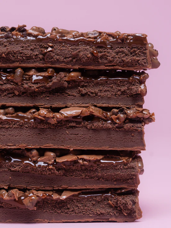 Barebells Chocolate Dough bar cross section showing chocolate dough layers and chocolate crisps