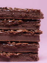 Barebells Chocolate Dough bar cross section showing chocolate dough layers and chocolate crisps