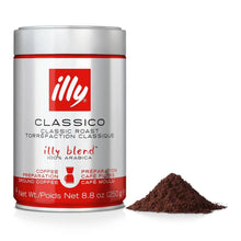 Ground coffee next to a silver and red canister labeled illy Classico Classic Roast 250g.