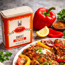 Sweet paprika spice tin with roasted chicken, bell peppers, and lemon garnish for flavorful meals
