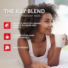 Woman enjoying a cup of coffee, featuring illy blend highlights like caramel and jasmine notes.