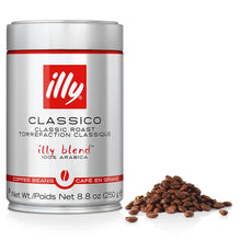 Silver can of illy Classico classic roast coffee beans with coffee beans pile, 250g.