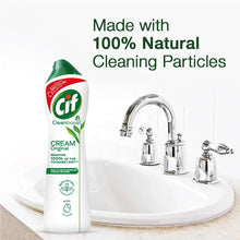 Cif Cream Original cleaner bottle on bathroom sink with olive oil and pasta sauce bottles nearby