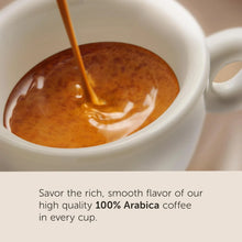 Close-up of espresso being poured into a white cup, highlighting creamy 100% Arabica coffee.