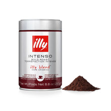 Illy Intenso Bold Roast ground coffee canister with espresso coffee grounds on white background
