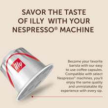 Illy coffee capsule for Nespresso machine, silver pod with red logo on beige background