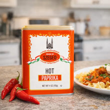 Hot Paprika spice tin from Szeged with fresh red chilies, perfect for cooking flavorful dishes