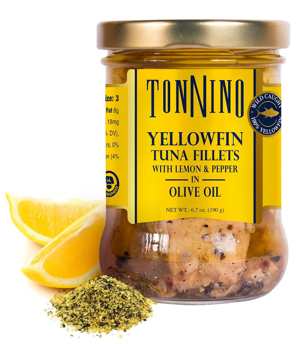 Jar of Tonnino yellowfin tuna fillets with lemon and pepper in olive oil on a white background