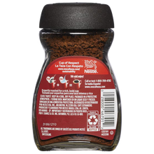A jar of Nestle Café Granola coffee shown from the back, featuring a black lid, brown coffee granules, and a red label with product information and a barcode.