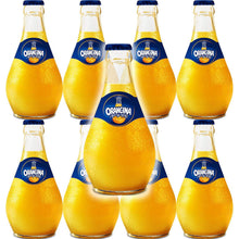 Chilled Orangina glass bottles with condensation, vibrant orange soda, imported refreshment