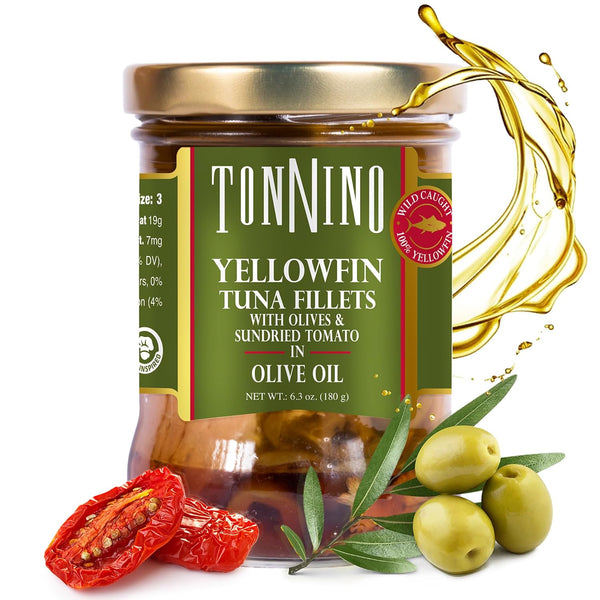 Jar of Tonnino yellowfin tuna fillets with olives and sundried tomatoes in olive oil, surrounded by ingredients.