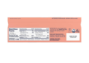 The back panel of a salmon-colored Bosterio Solid Light Tuna in Olive Oil package, displaying the nutrition facts, ingredients, and barcodes.