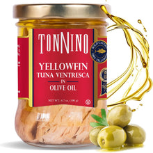 Jar of Tonnino Yellowfin Tuna Ventresca in Olive Oil with olives and oil splash on a white background