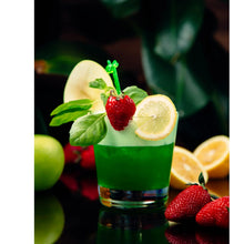 Vibrant green drink with strawberry, lemon slice, and mint garnish, surrounded by fresh fruits