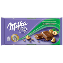 Milka hazelnut Alpine milk chocolate bar with whole hazelnuts in purple packaging